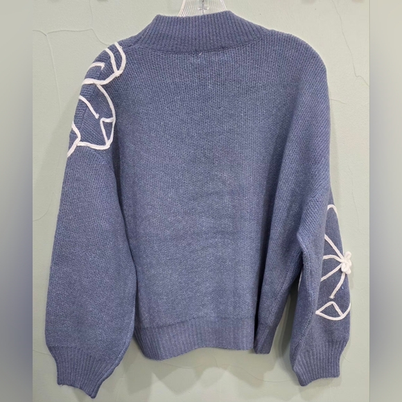 Blue Sweater with White Flower Stitch Detailing - Picture 2 of 5